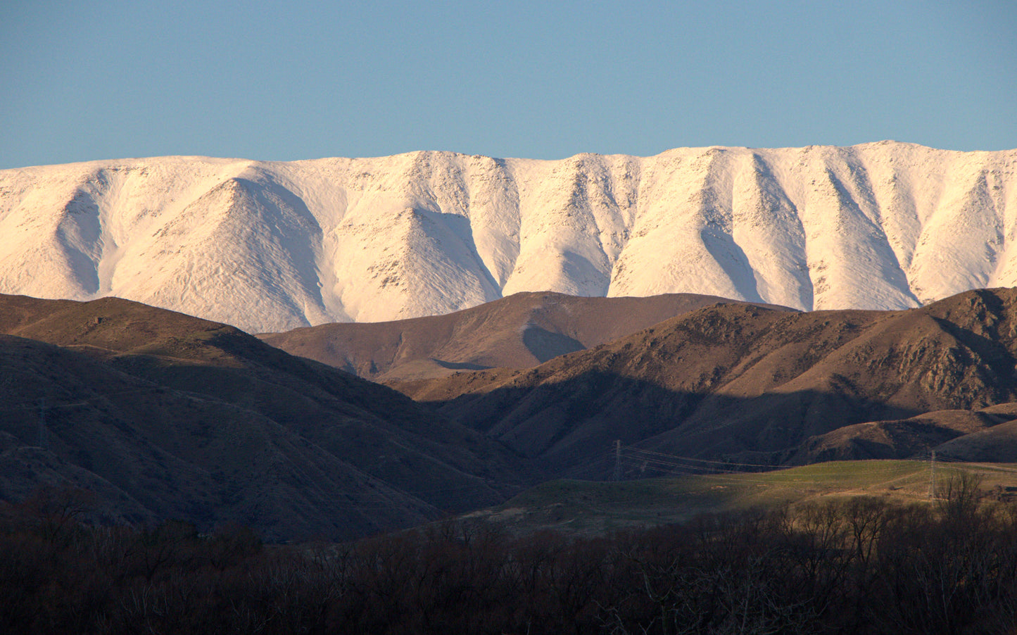 Snow-capped mountains with a clear blue sky