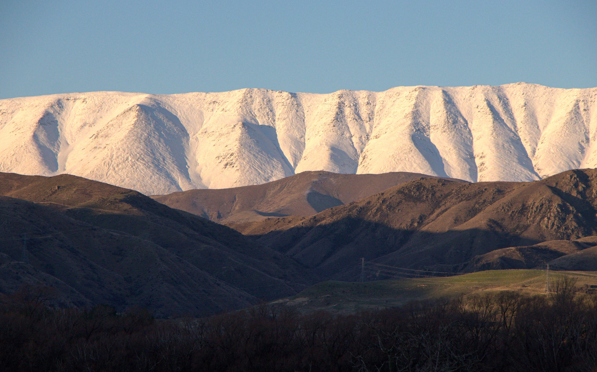 Snow-capped mountains with a clear blue sky