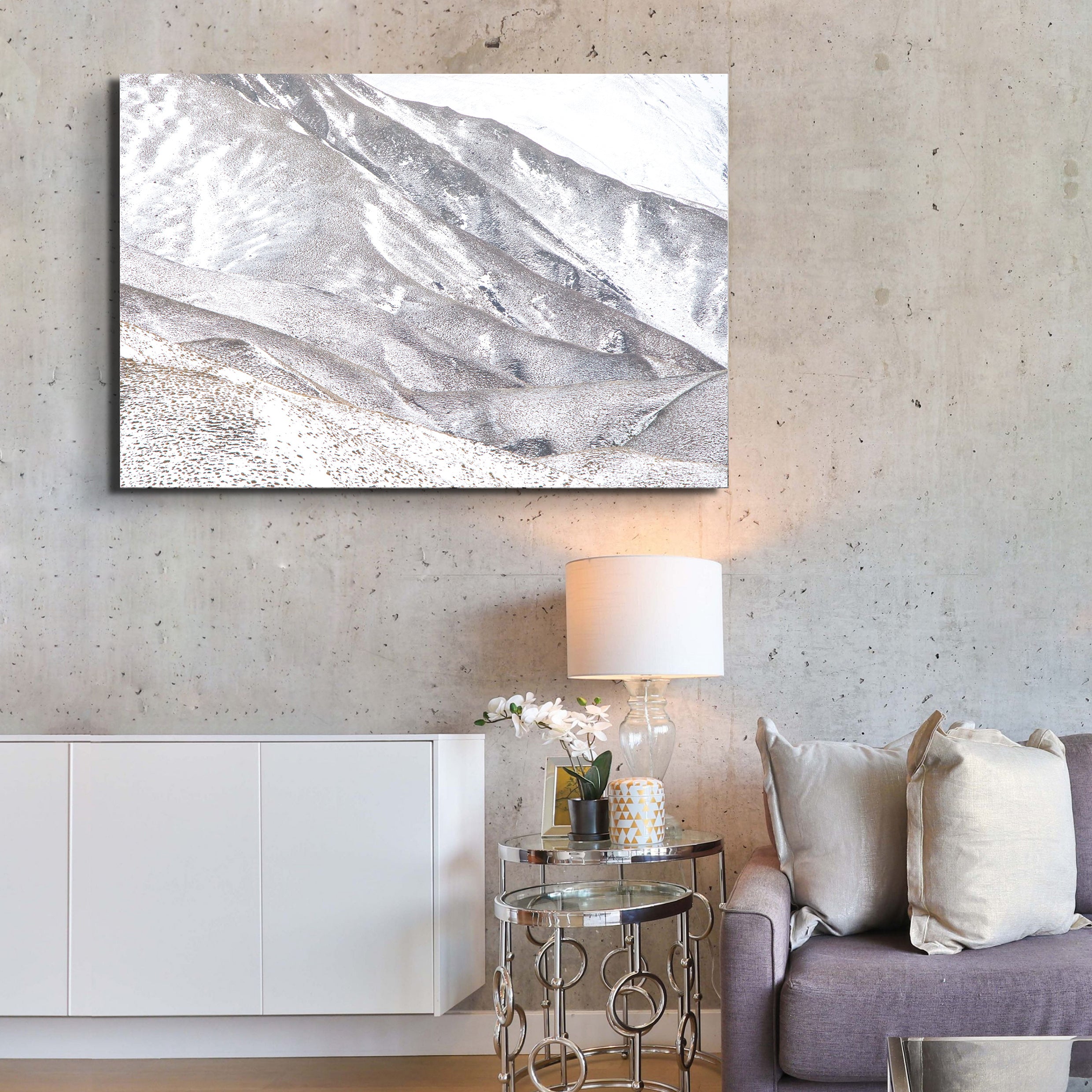 Living room with abstract painting, lamp, and sofa